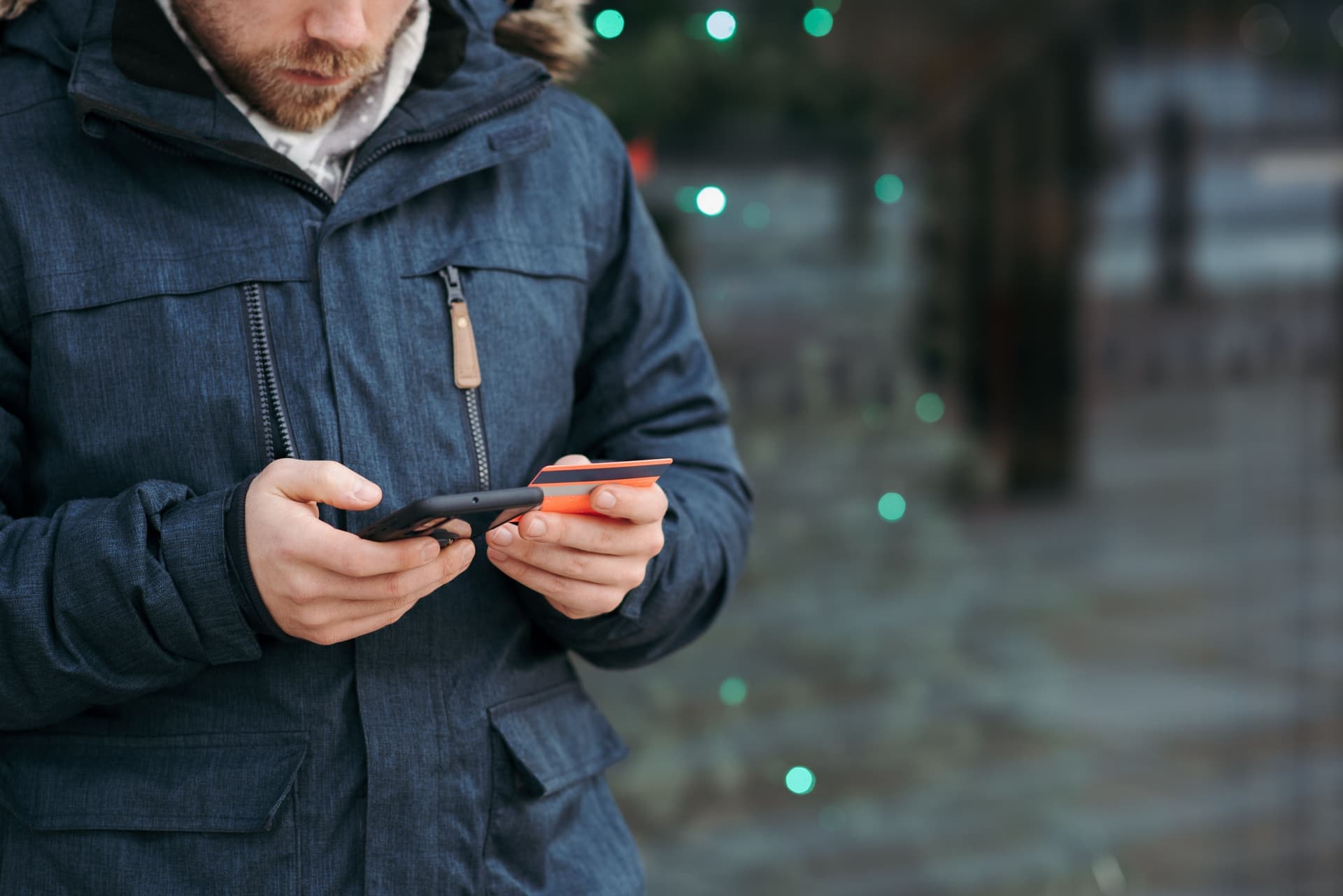 A person browsing jewelry listings on a phone