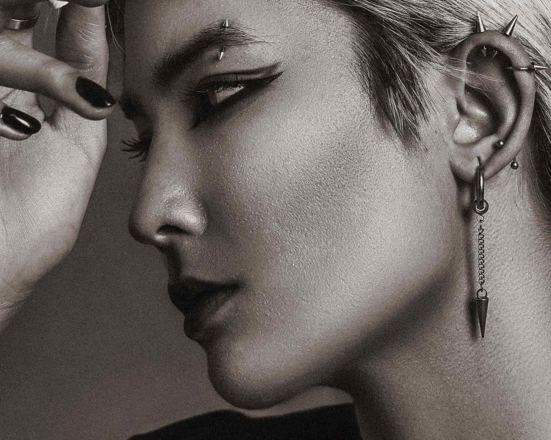 A small stud earring worn in a lobe, photographed closely